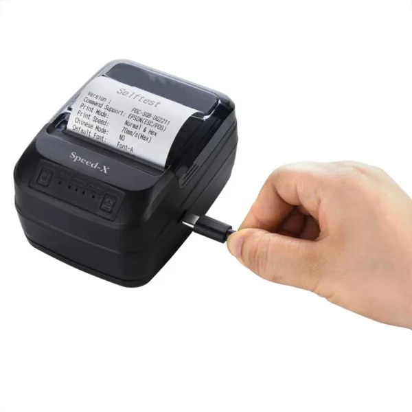 Speed-X BT450M held in hand demonstrating lightweight pocket-sized portability