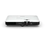 Epson EB-1785W ultra-slim Wireless Projector resting next to a laptop computer
