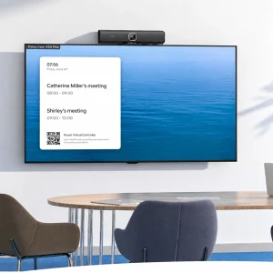 Anker PowerConf B500 mounted securely on top of an office monitor using integrated bottom clip