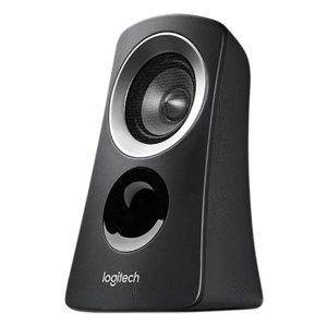 Logitech Z313 speakers placed on a modern PC desk next to a laptop monitor